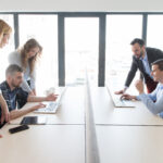 Group of colleagues working in contemporary office